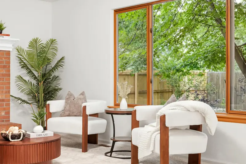 Staged sitting area by a large window