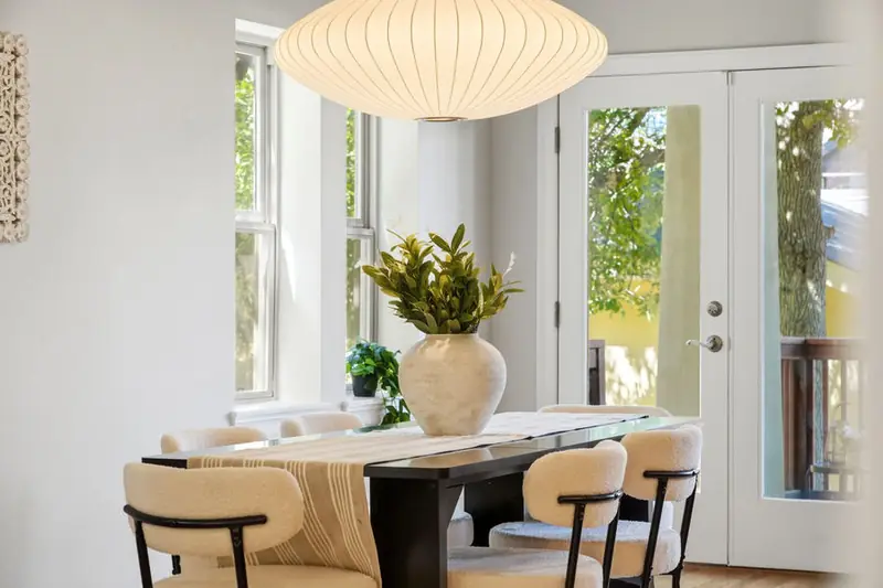 Staged dining room with a paper pendant