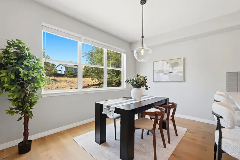 Staged dining table by a window